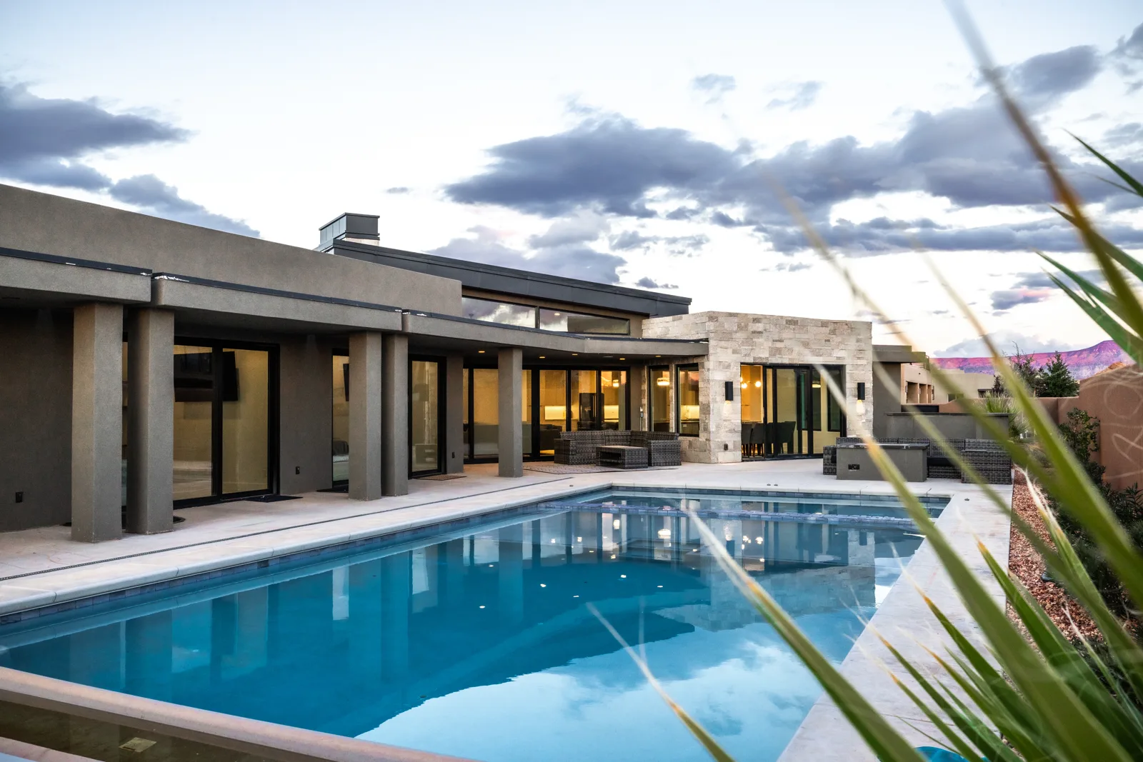 Finished custom home, pool at dusk