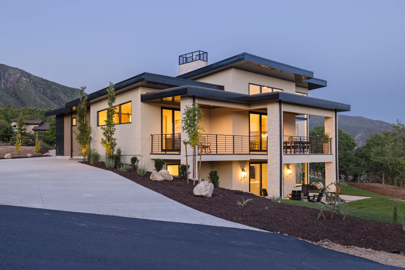 Modern mountain home at dusk
